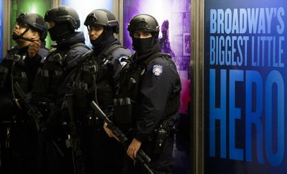  New York City police officers patrol the Times Square/42nd Street station of the New York City transit system in New York, New York, USA, 22 March 2016.
