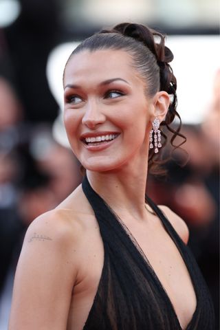 Bella Hadid attends the "L'Amour Ouf" (Beating Hearts) red carpet at the 77th annual Cannes Film Festival at Palais des Festivals on May 23, 2024 in Cannes, France