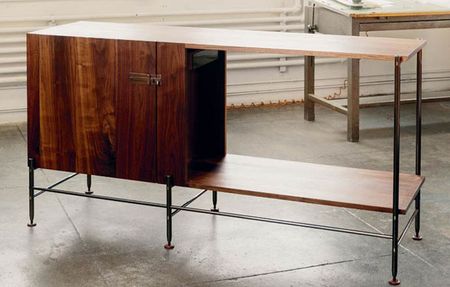 A wooden home bar console. 