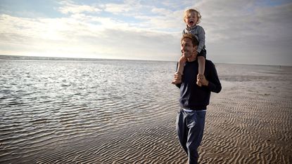 A father and child on the beach