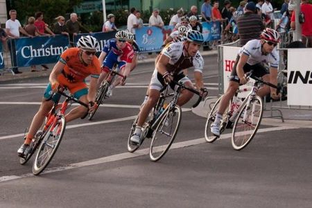 British rider Ed Clancy (c) stays near the head of the field.