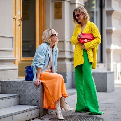 Emili Sindlev wearing yello knit cardigan and green wide leg pants