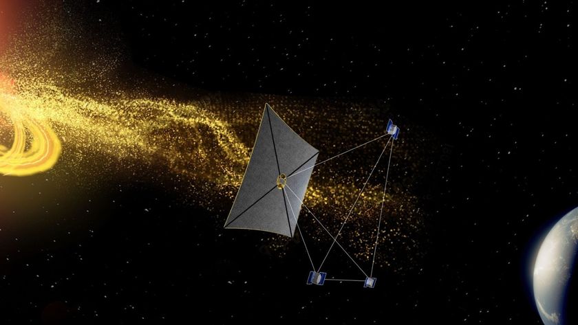 a rectangular kite-like spacecraft flies between a helix of yellow particles and earth on a starry black background