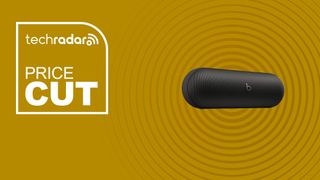 The Beats Pill on a yellow background with text saying Price Cut.