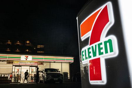 People walk out of a 7-Eleven convenience store in Yokohama on August 23, 2024