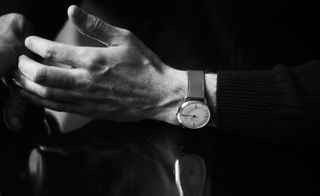 A man's hand and arm with a Sekford watch on