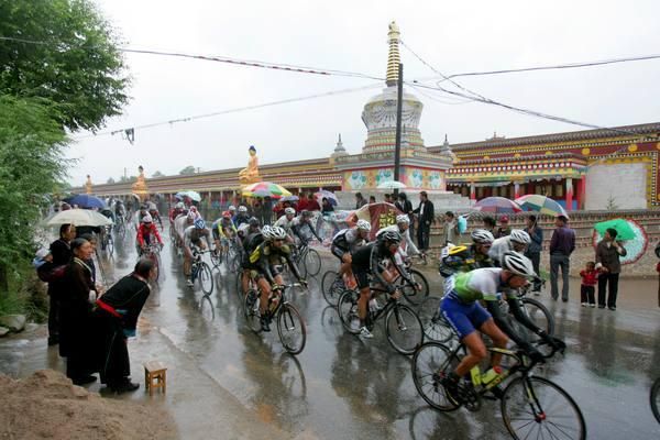 The peleton ride past a small monestery early on in the stage.