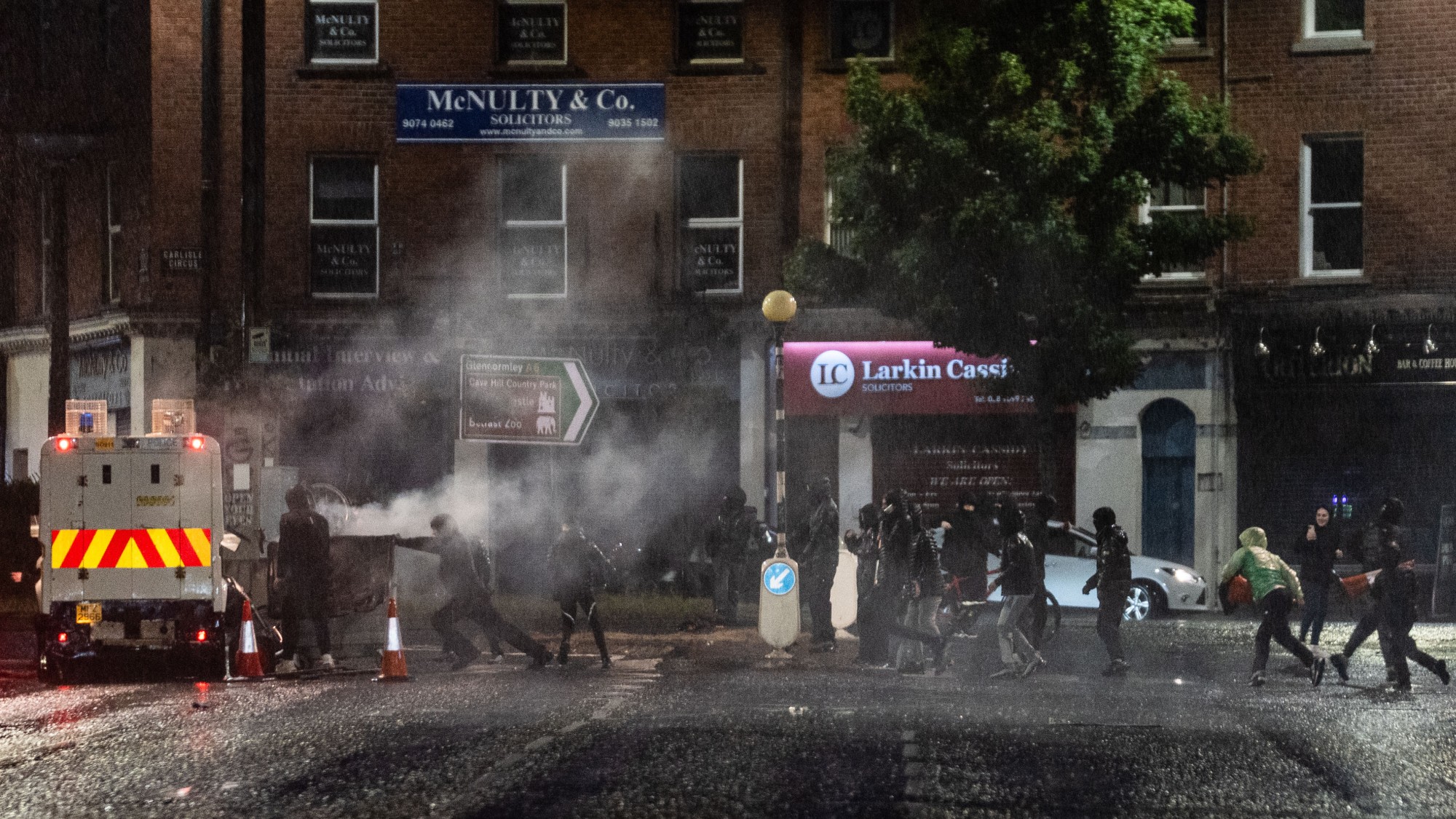 Youths attack a police van on a Belfast street