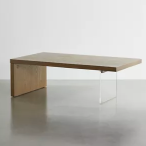 rectangular wooden coffee table with one acrylic leg