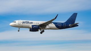A JetBlue aircraft in the air