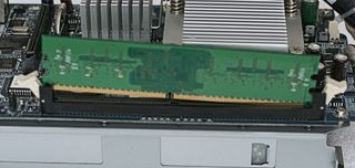 Loosen the clips, then lift up the old DIMM to remove it