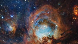 a round, colorful cloud of gas on a starry background