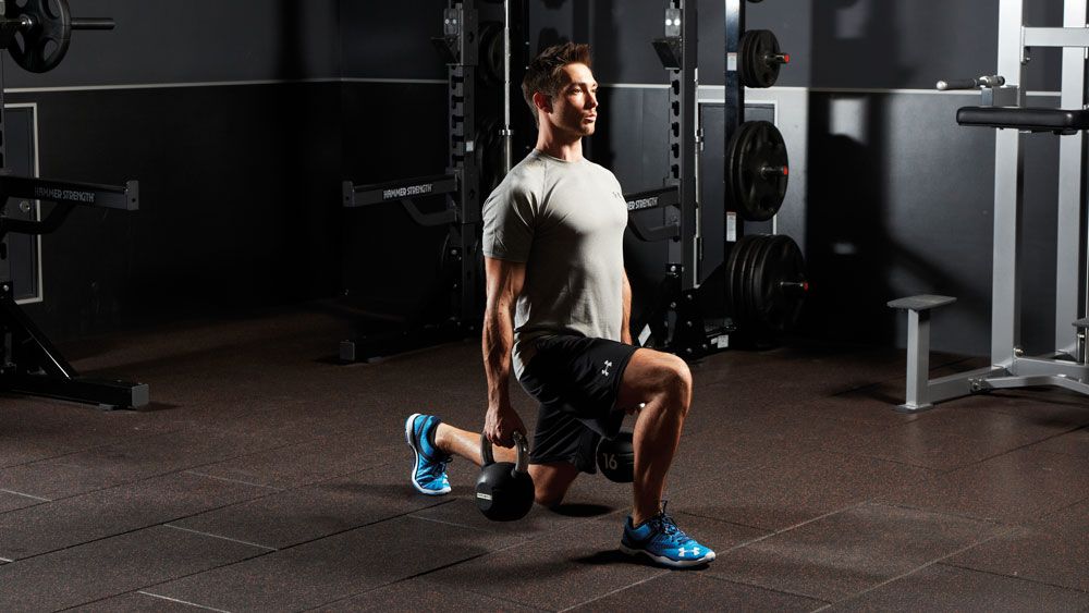 A kettlebell walking lunge as part of a free-weights workout