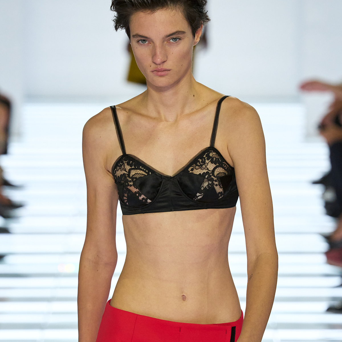 Collage of runway models wearing the spring 2027 bra trend as seen at fashion month.