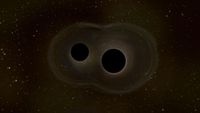An illustration showing two black holes next to each other against a dark background.