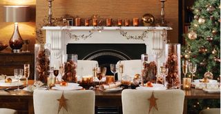 Christmas dining table with Pinecones in glass vases to make a fashionable table runner