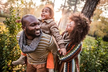 family (two parents and toddler) enjoy nature - domini mutual funds is a sustainability-oriented company