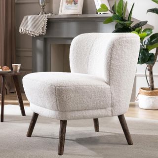 cream sherpa armless chair in a living room