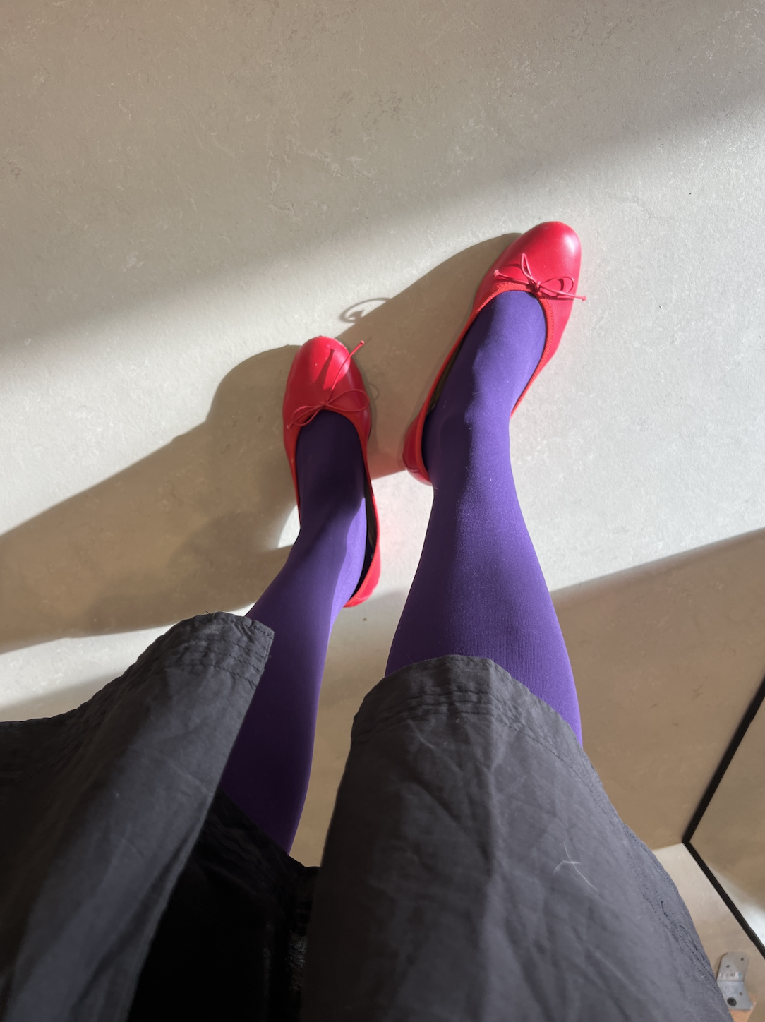 Vivian Li in purple tights and red shoes