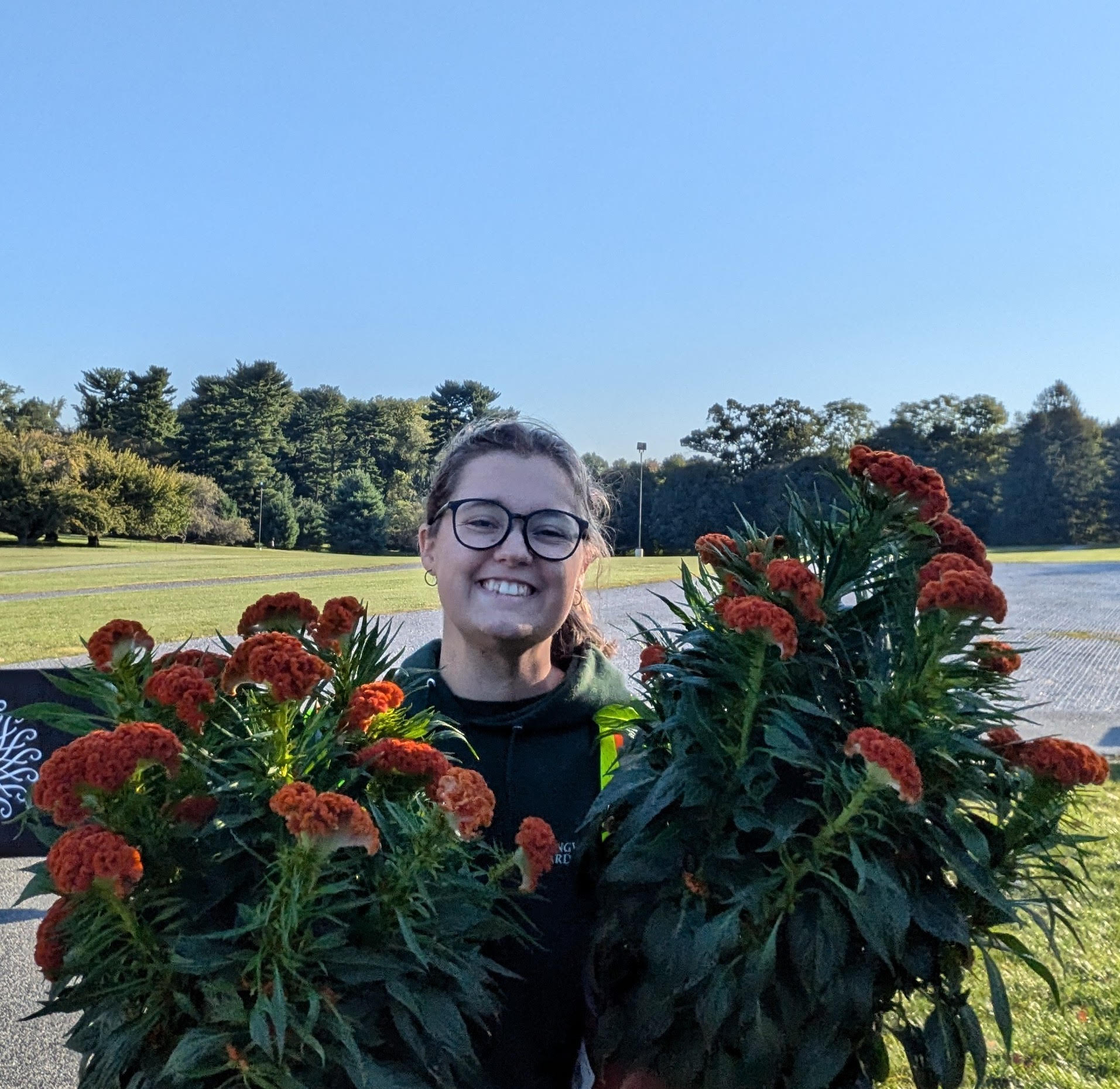 An image of Militca Denee holding plants