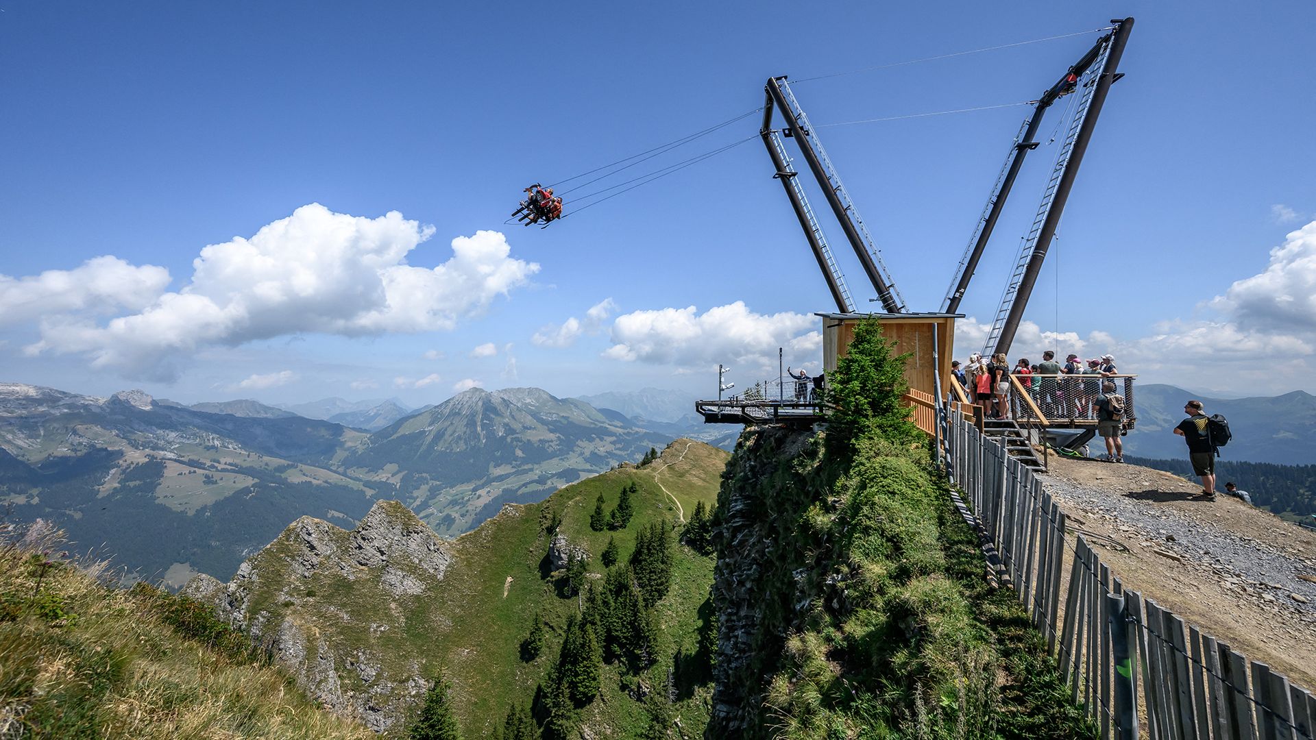 
                                Tourists ride the BalancAIR swing on the peak of Le Chamossaire, near Villars-sur-Ollon in Switzerland
                            