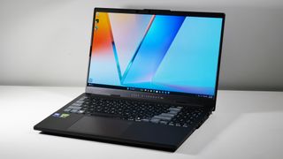 Asus Vivobook Pro 15 (N6506, 2025) open at an angle on a white table.