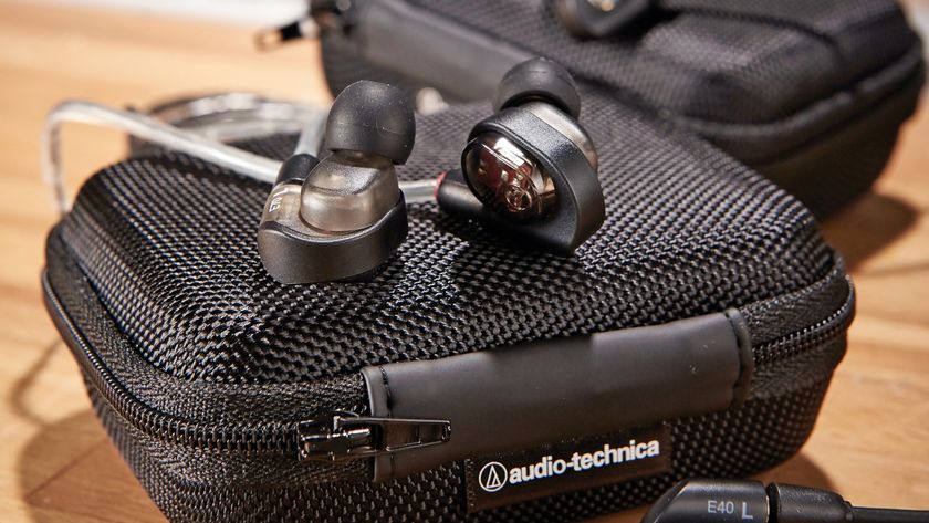 A pair of Audio-Technica in-ear monitors on top of a carry case