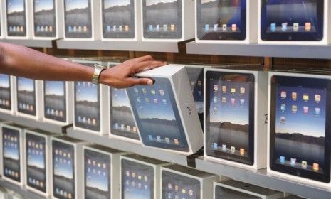 Shelves of iPads on display at London&amp;#039;s flagship Apple store: Apple makes a big chunk of its money overseas, where it shelters much of its profit from U.S. taxes.