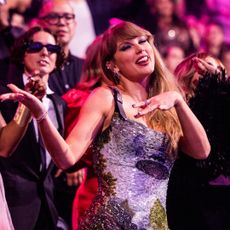 Taylor Swift dances wearing a UFO mini dress at the 2024 VMAs