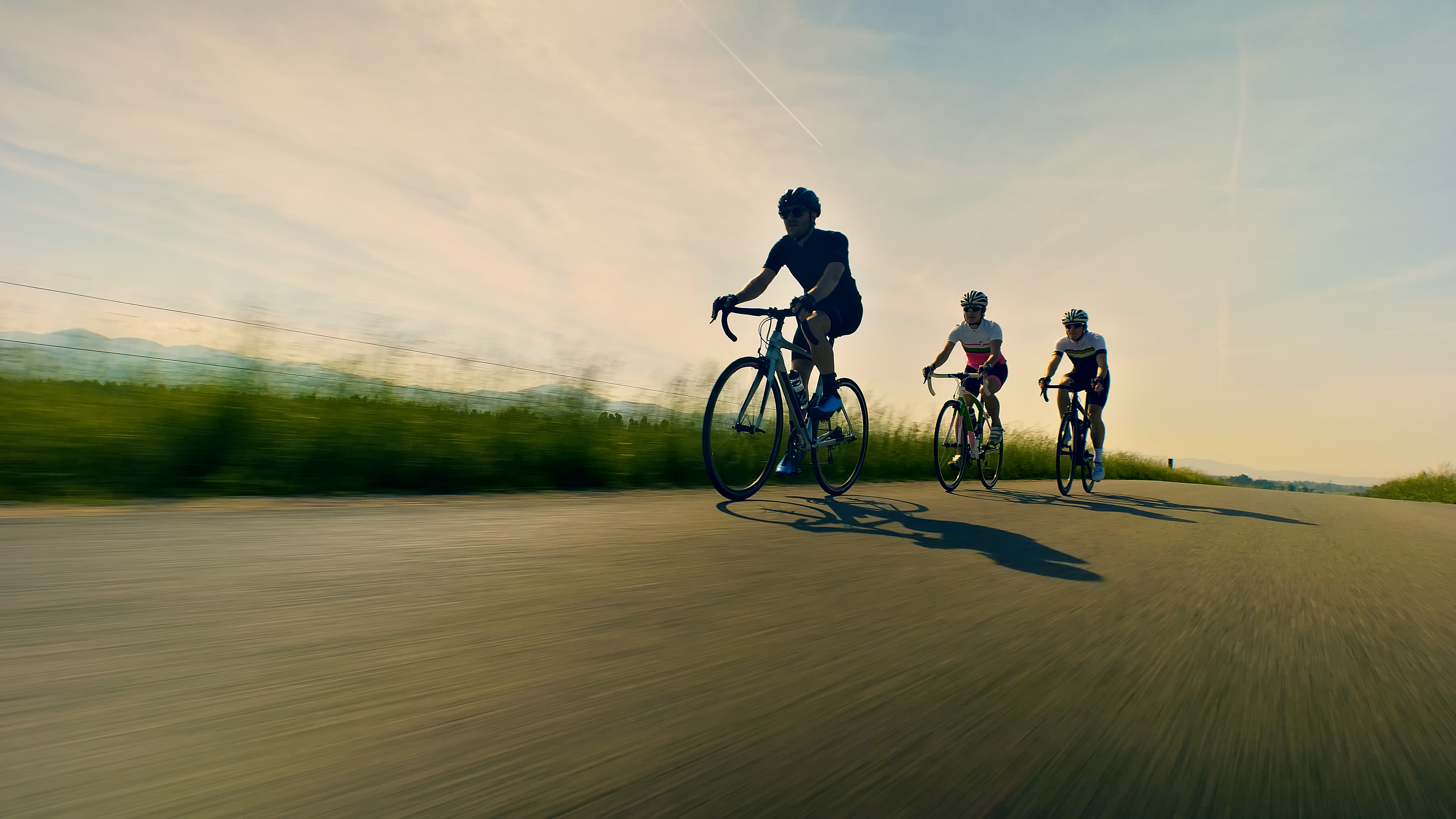 Three riders on road bikes