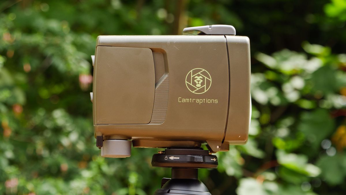 Camtraptions Camera Trap device outdoors with foliage backdrop