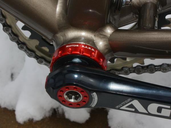 Rotor's Self Aligning Bottom Bracket uses spherical bearing mounts to account for non-parallel shell faces.