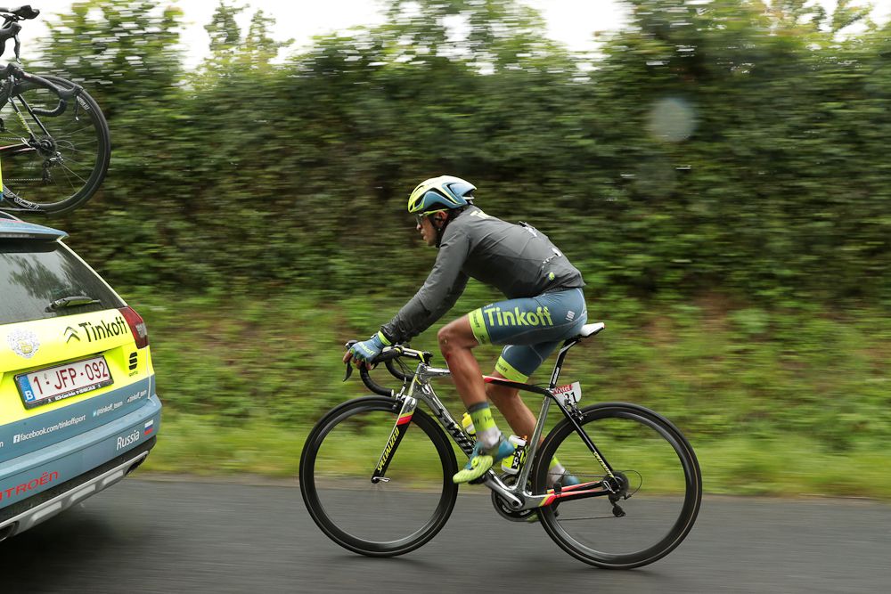 Alberto Contador makes his way back to the bunch after a stage 2 crash