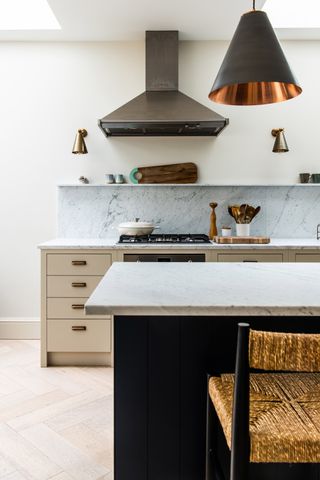 Neutral kitchen with marble slab splashback