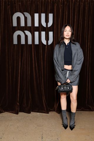 Maddie Ziegler wearing a grey jacket and matching shorts at a Miu Miu event in Paris, France on March 5, 2024.