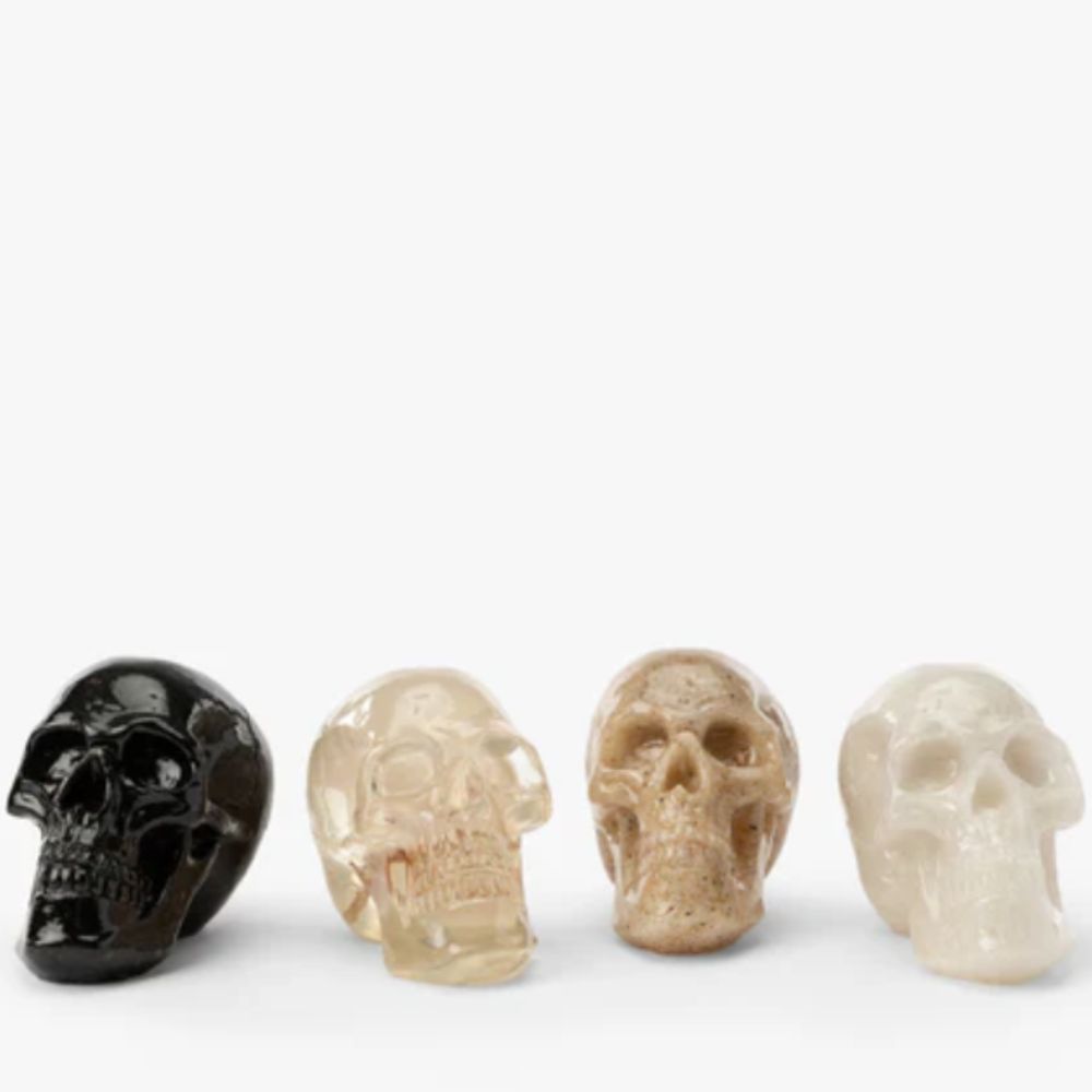Set of four resin skull decorations
