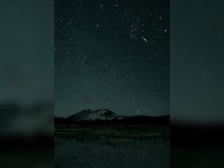 The night sky above Sunset Crater National Monument, shown above, is one of three International Dark Sky Parks in the Flagstaff area.