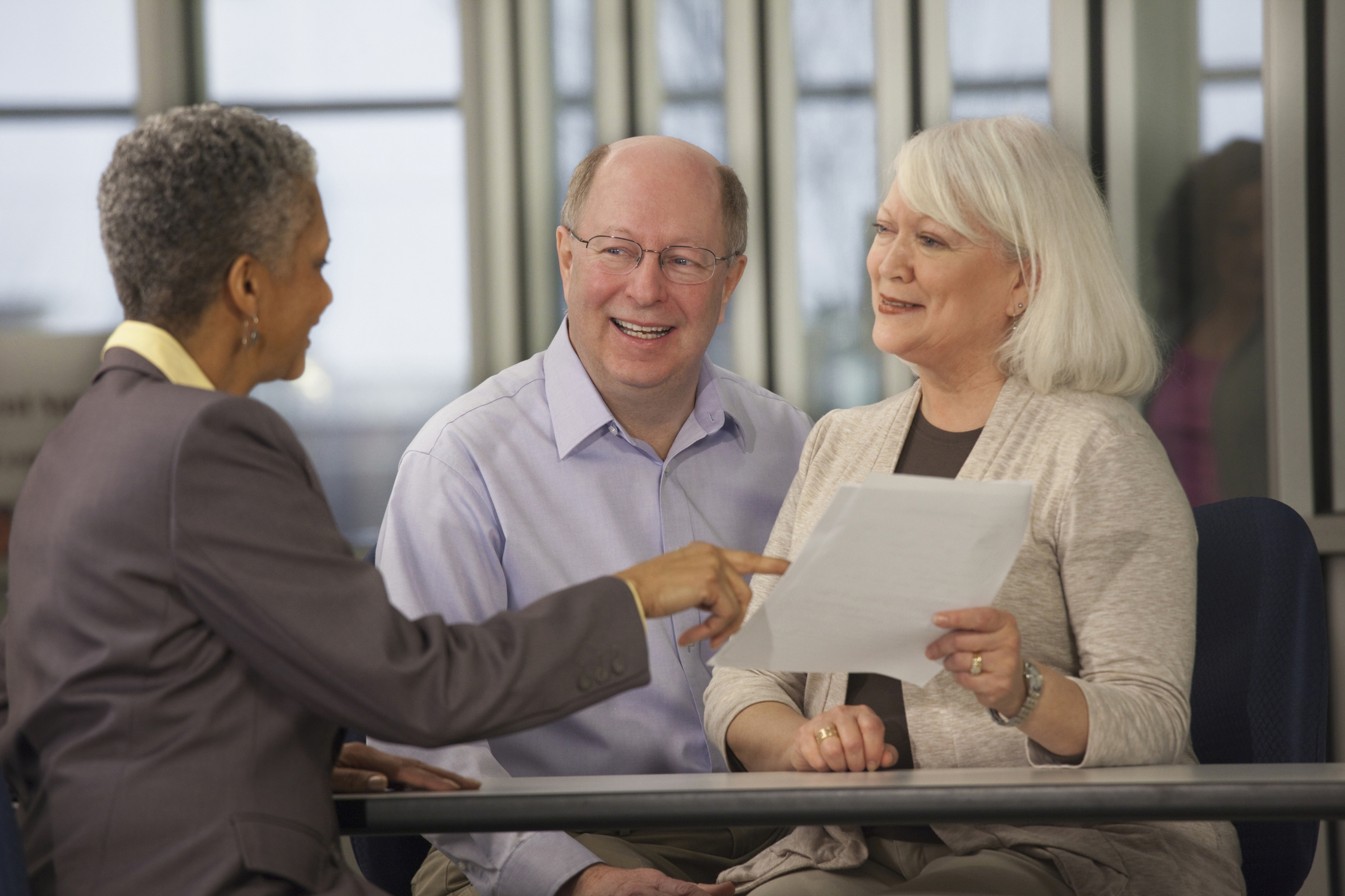 Couple with a financial adviser 