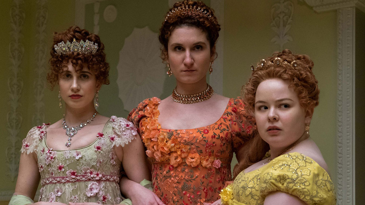 Penelope and her two sisters in Bridgerton ball gowns.