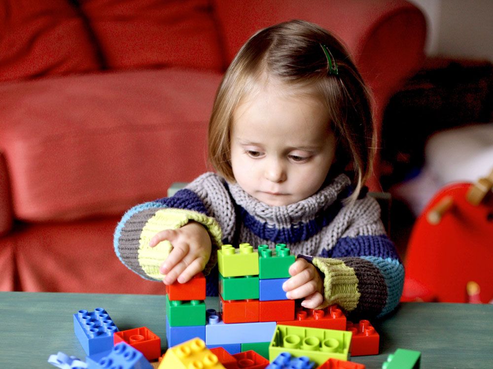 Girl Playing With Lego