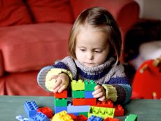 Girl Playing With Lego