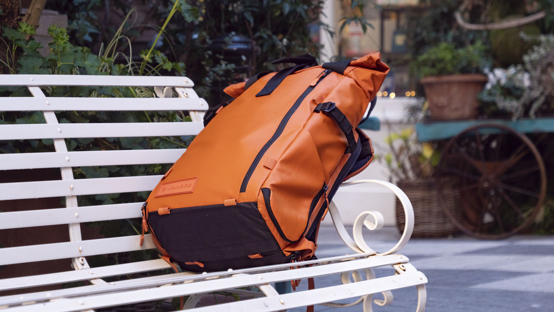 Wandrd PRVKE V4 bag on a white metal bench