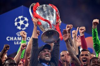 Jurgen Klopp celebrates with the Champions League trophy after Liverpool's win over Tottenham in the 2019 final.