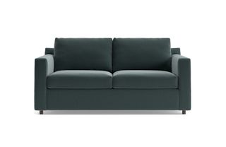 A dark green velvet sleeper sofa