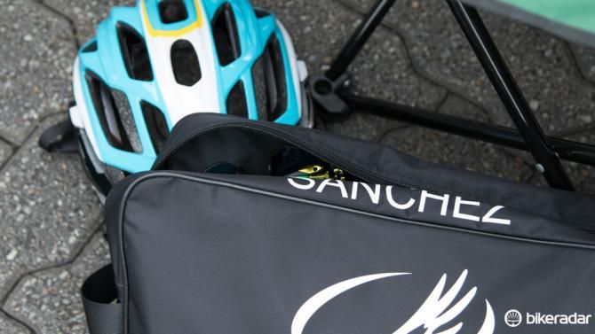 The Astana gear bag of Luis Leon Sanchez hides a gold pair of Oakley Radarlock glasses