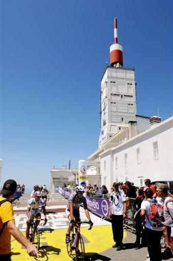 Riders cross the finish line atop Mont Ventoux in south eastern France.
