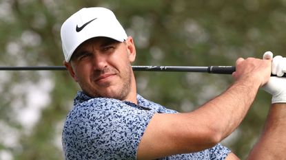 Brooks Koepka takes a shot in a practice round before the 2023 Saudi International