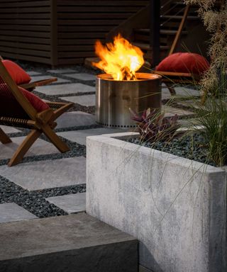 modern paving with gravel by belgard with fire pit