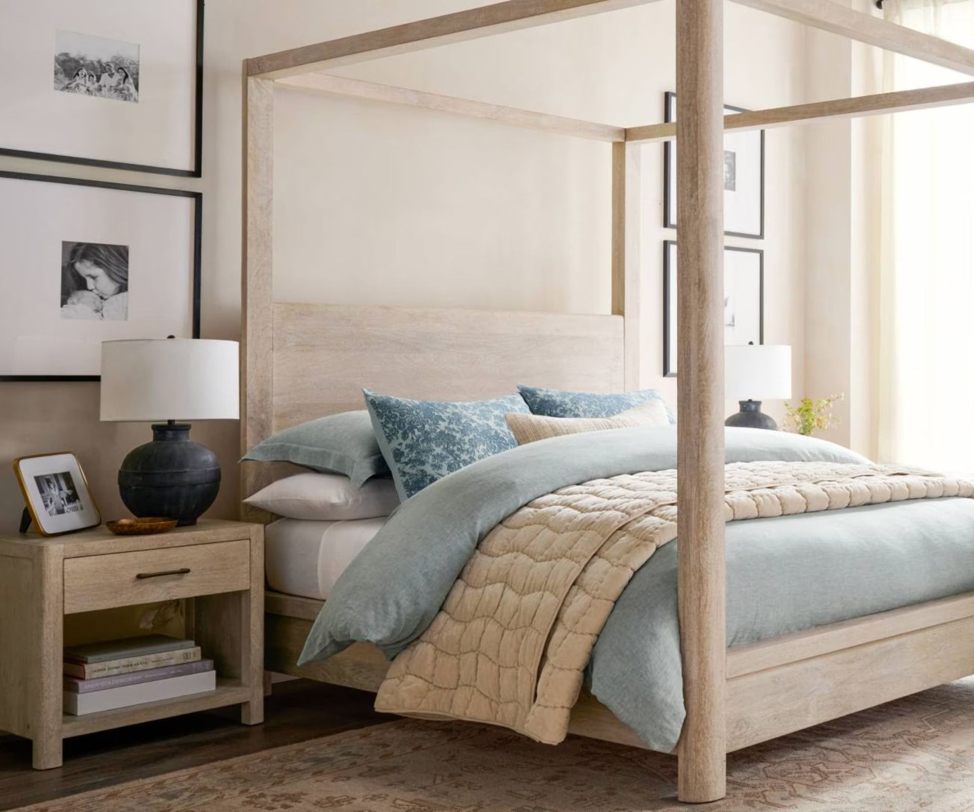 coastal style bedroom with white washed distressed four poster bed and beige and beige bedding