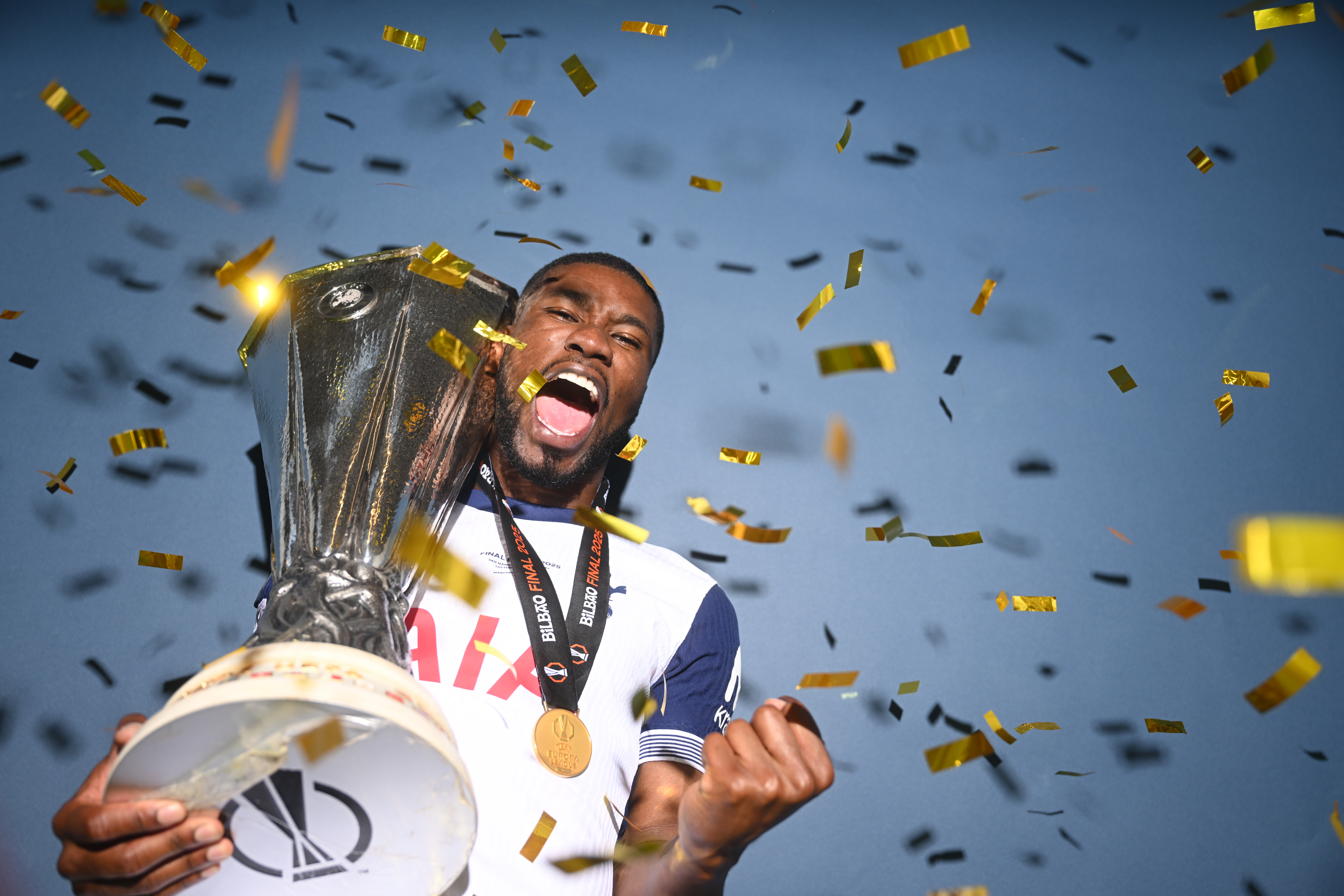 Kevin Danso celebrates with the Europa League trophy